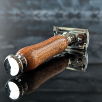 detail view of a hand-crafted safety razor with a mesquite handle from MC Shave Gear