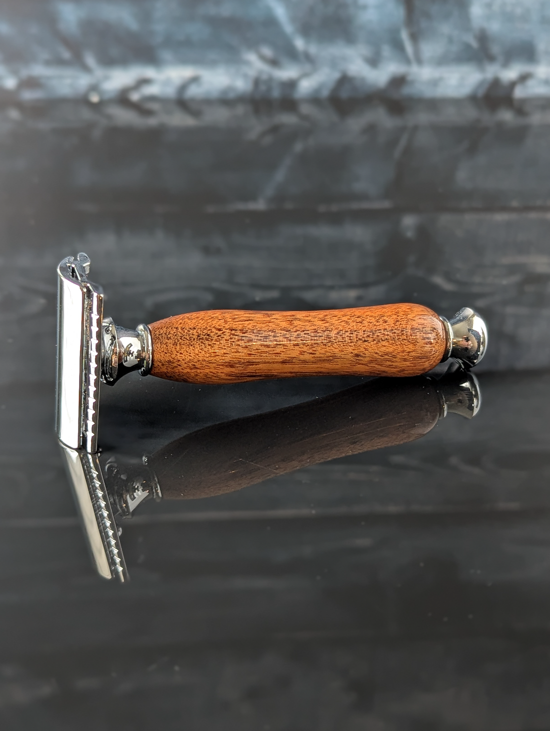 profile view of a hand-crafted safety razor with a mesquite handle from MC Shave Gear