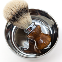 silvertip badger shave brush with a mesquite handle in a silver shave bowl