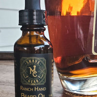 Ranch Hand Beard Oil with a bottle of bourbon