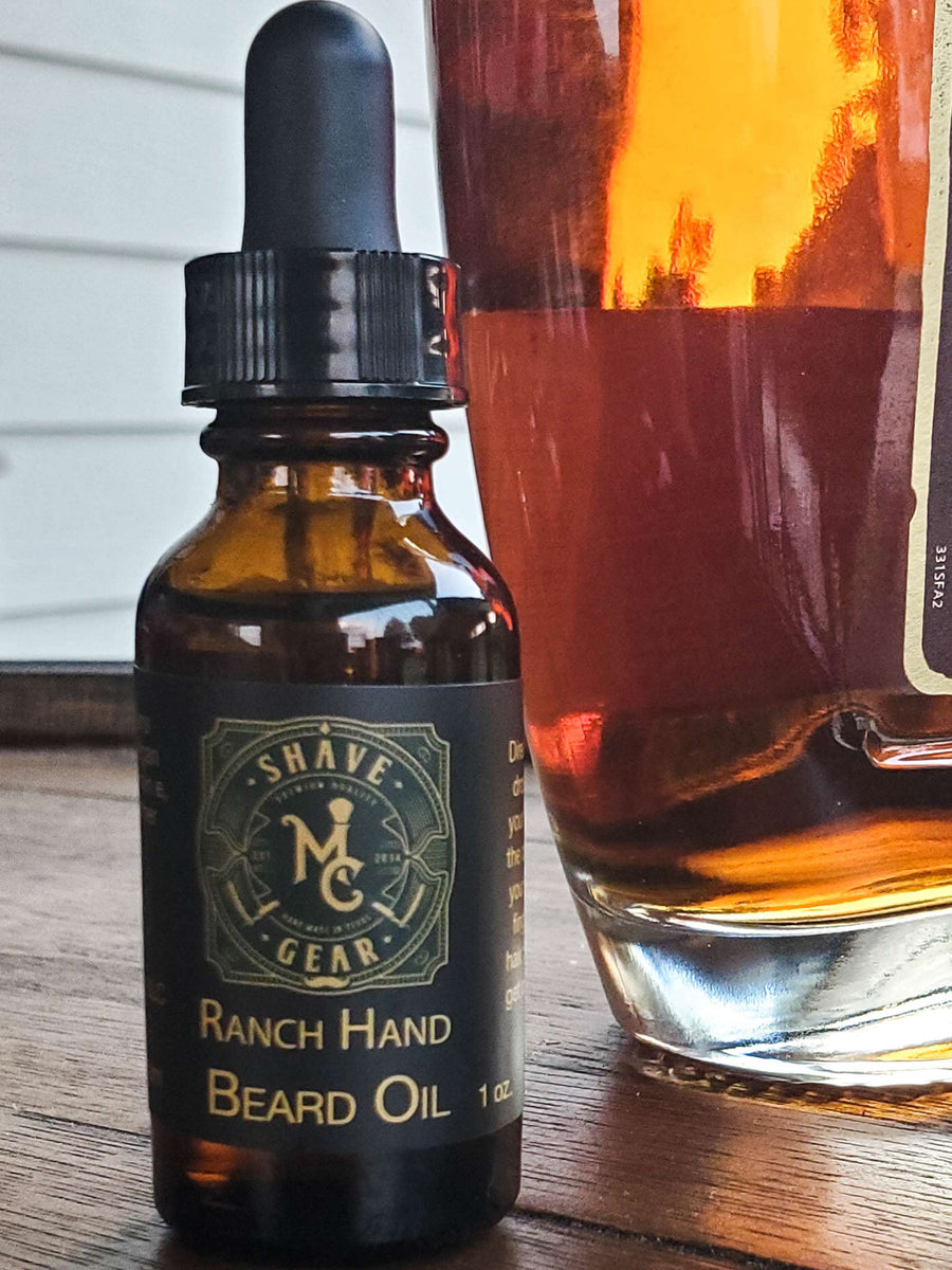 Ranch Hand Beard Oil with a bottle of bourbon