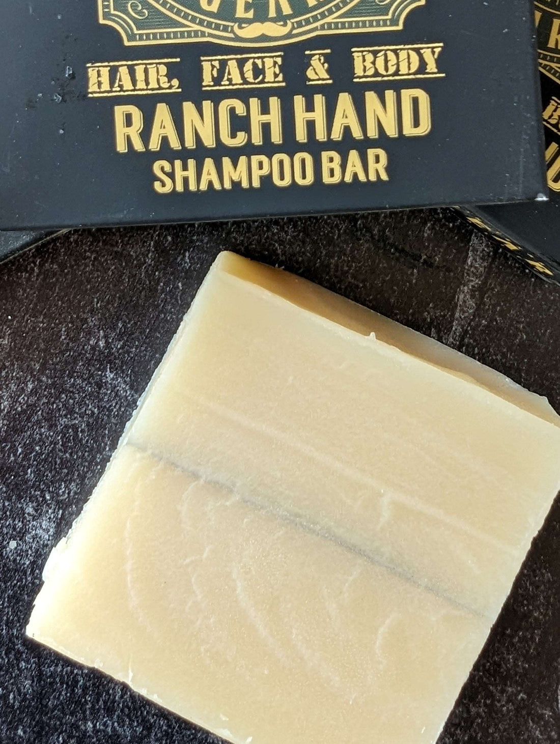 Ranch Hand All-In-One Hair, Face & Body Shampoo Bar for Men top view with the box and logo